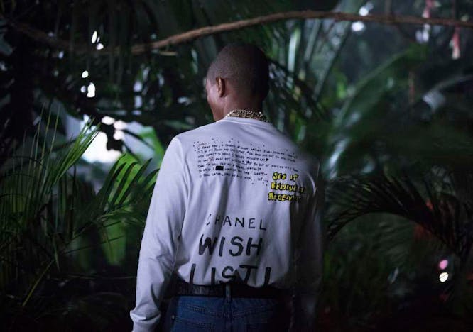 a still from the chanel-pharrell capsule collection film person human clothing apparel sleeve