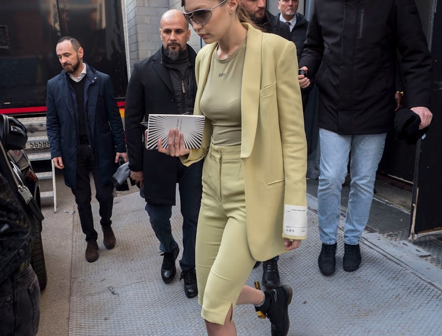 clothing apparel shoe footwear person sunglasses accessories coat overcoat pedestrian