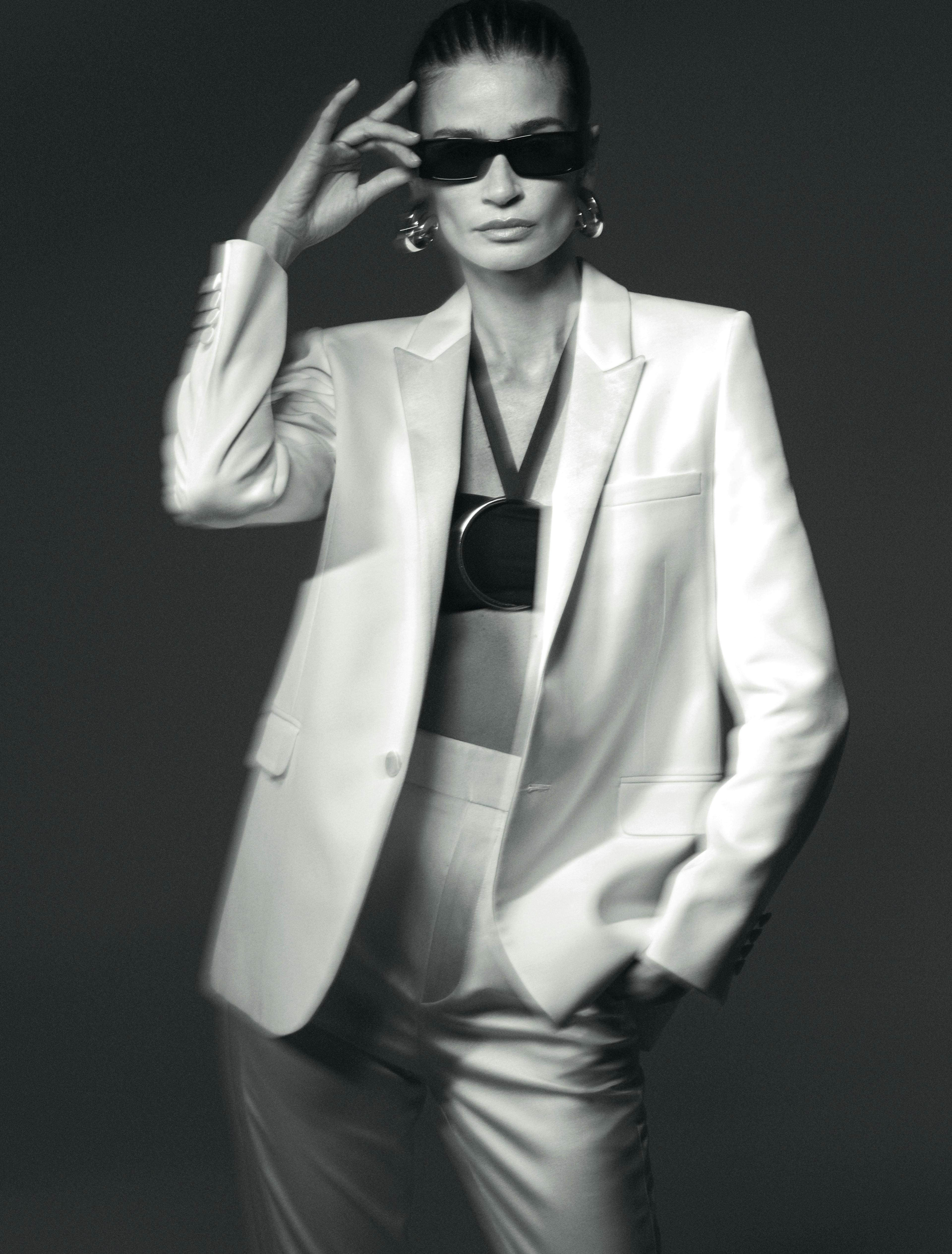 clothing apparel suit coat overcoat sunglasses accessories person tie female