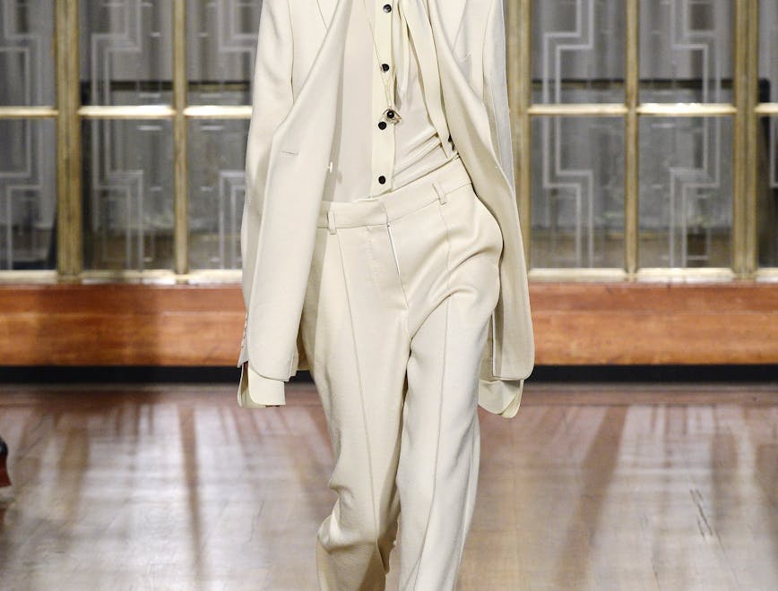 suit clothing overcoat coat apparel flooring person floor female man