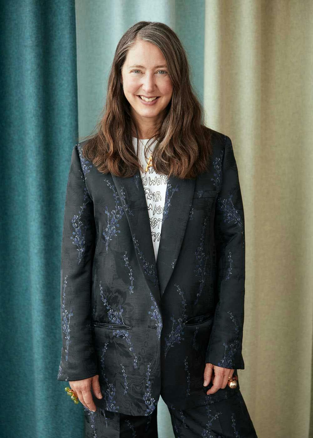 clothing apparel coat overcoat jacket suit blazer female person sleeve