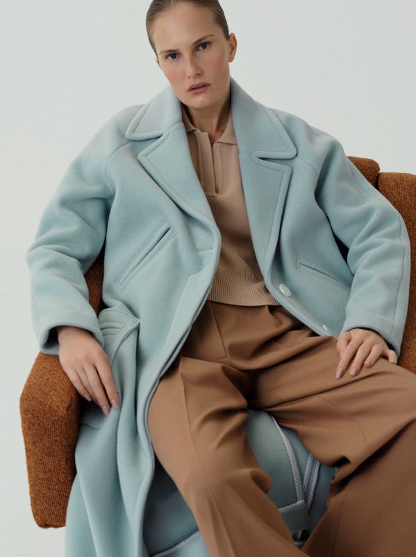 clothing apparel suit overcoat coat person human blazer jacket