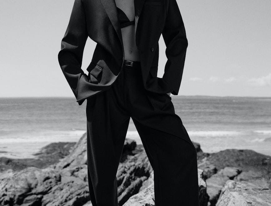 clothing apparel suit overcoat coat person human female tuxedo