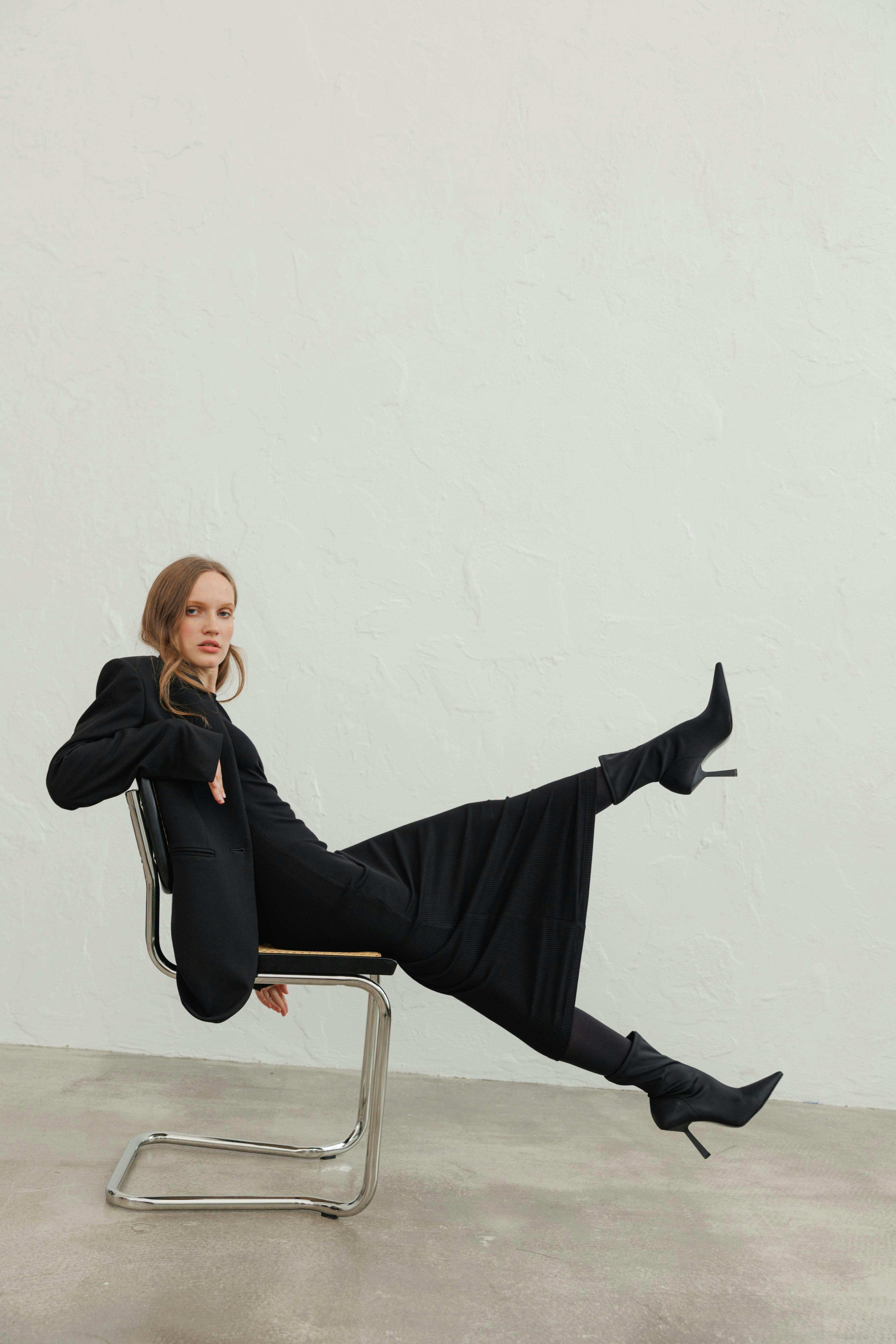 shoe high heel formal wear woman adult female person sitting coat furniture