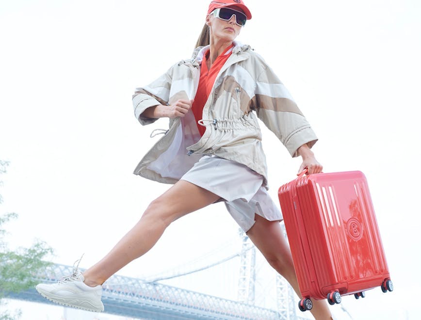 Woman with Bogner hard shell suit case