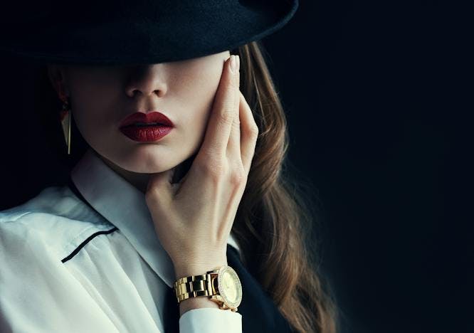 makeup,studio,big,beauty,shadow,trend,space,empty,red,chic,outfit,golden,hat,model,text,female,attractive,dressed,girl,fashionable,light,background,indoor,style,earrings,woman,dandy,skin,wear,long,hair,dark,copy,elegant,pretty,sensual,sexy,black,people,hide,lips,classic,fedora,watch,lady,luxury,well,accessory,posing,fashion finger hand person adult female woman hat lipstick face photography