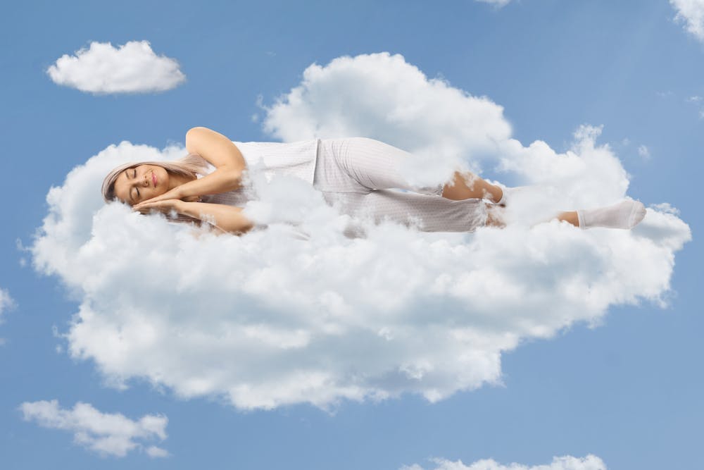 Woman sleeps on a cloud