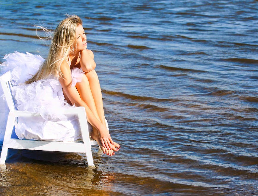 bride,love,dancing,dress,romance,woman,beauty,jumping,young,caucasian,dreams,sea,summer,beautiful,freedom,white,happiness,barefoot,wedding,female,sky,smiling,nature,one,cheerful,people,water,dancer,enjoyment,outdoors,idyllic,person,vacations,beach,sensuality,adult,travel person sitting beachwear clothing nature outdoors sea water
