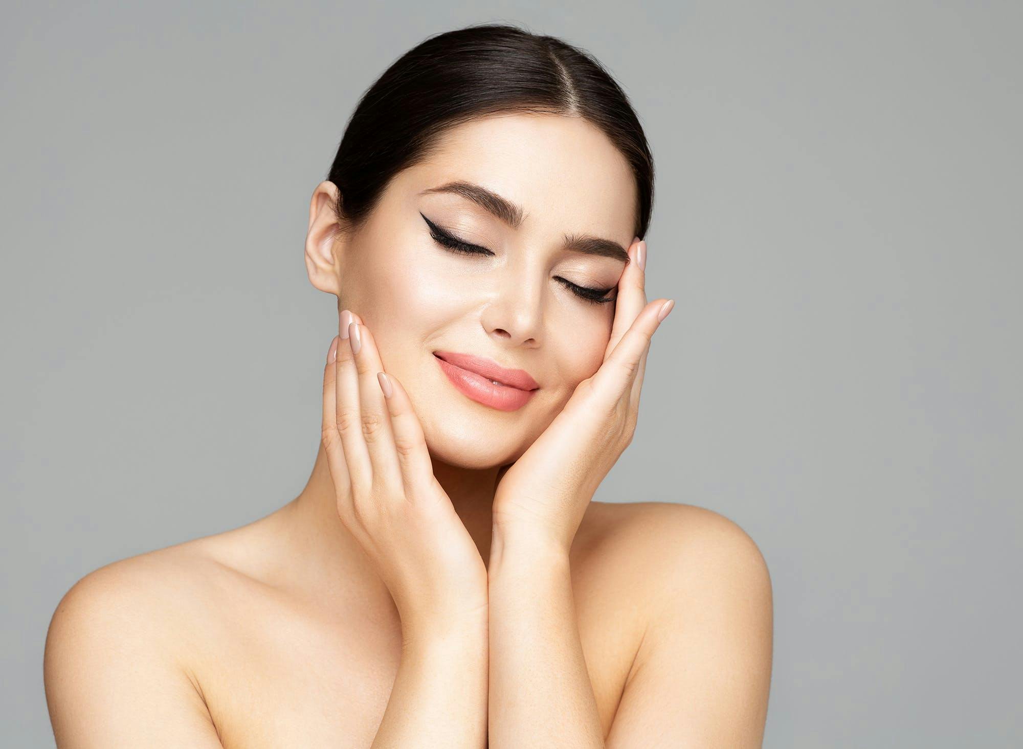 aesthetic,makeup,studio,hands,beauty,perfect,happy,enjoying,beautiful,make up,model,female,massage,plastic surgery,eyes closed,dreaming,smiling,spa,pamper,girl,cosmetology,cheeks,background,care,salon,women,treatment,woman,eyeliner,isolated,skin,lipstick,dermal,facelift,cosmetics,gray,facial,smooth,applying,chin,touching,therapy,health,portrait,people,face,lips,mouth,permanent,filler adult female person woman head face skin
